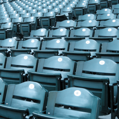 Photo of green seats in a baseball stadium.